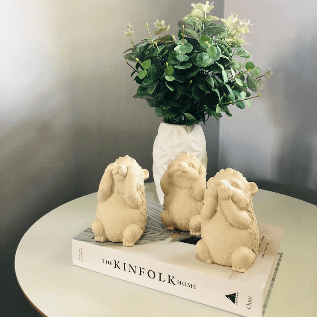 Trio of wisdom Kit Squirrels Porcupine in cement